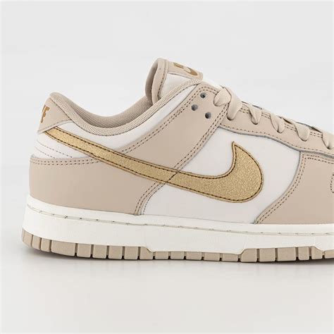 gold Nike dunks low